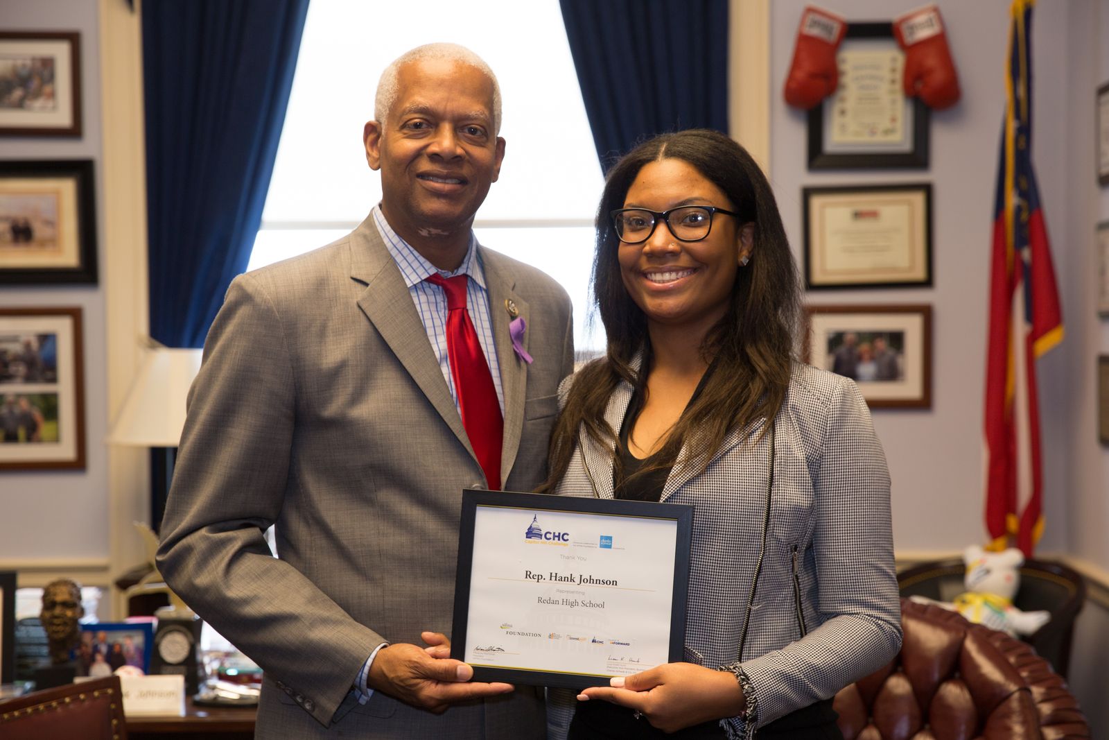 Rep. Hank Johnson and a student with a CHC certificate