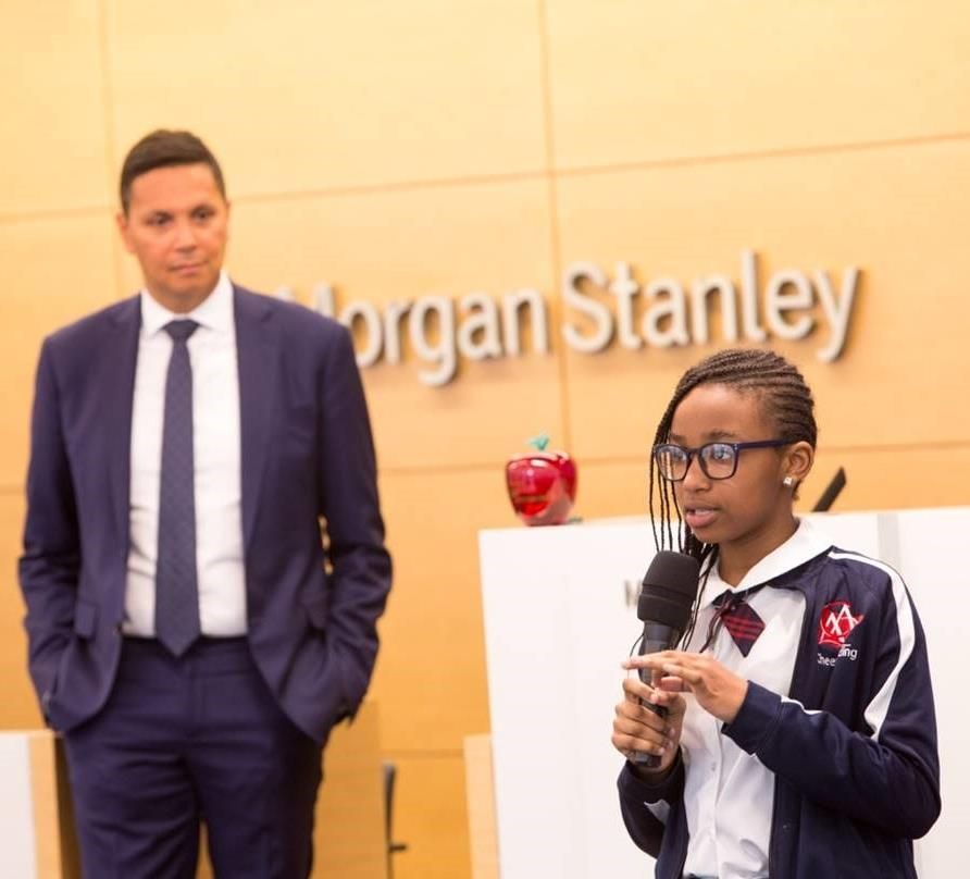 A student speaking at a firm visit