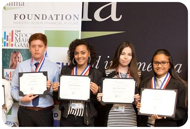 Student winners holding award certificates